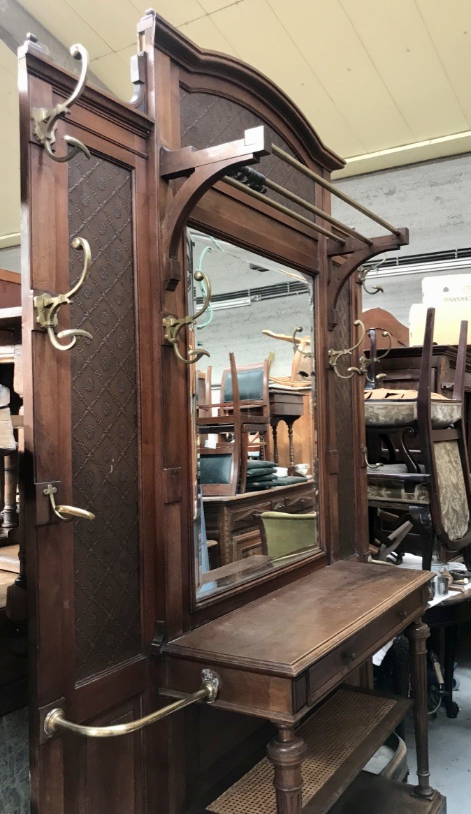 Large French 19th century walnut & pressed metal panelled hall stand with bronze hooks and mirror back.