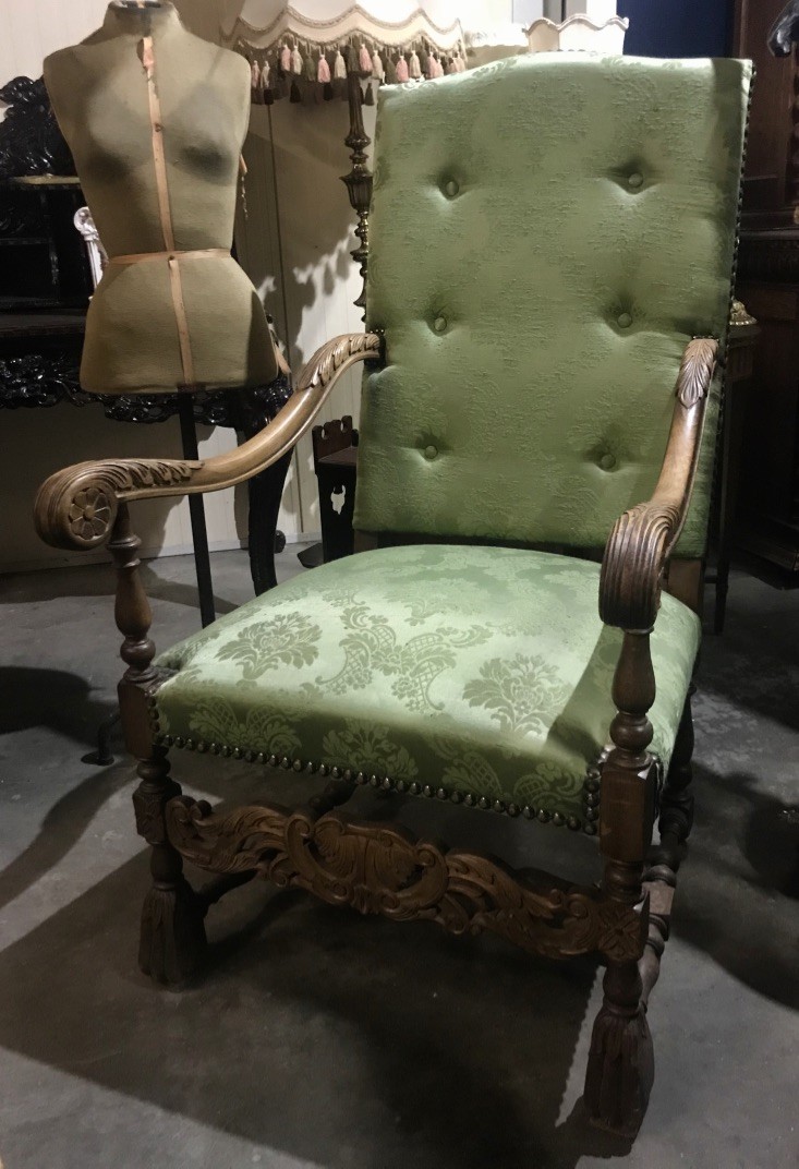 French early 20th century carved oak & green upholstered fauteuil.