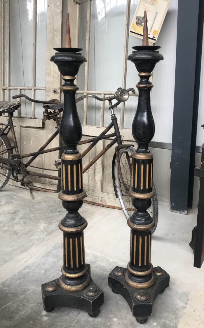 Pair of tall 19th century French ebonized and gilt decorated candle sticks.