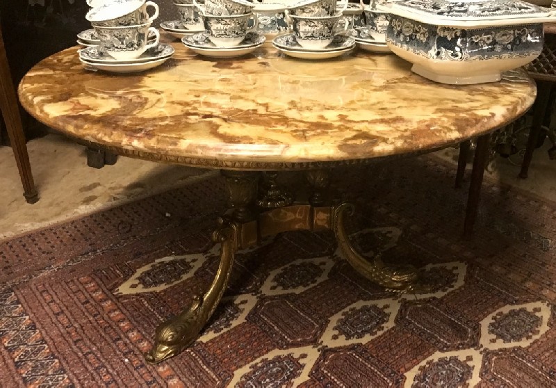 Decorative green onyx and brass dolphin coffee table.