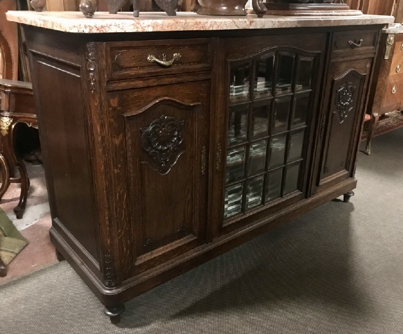 French provincial oak & floral carved three door display buffet having rouge marble top.