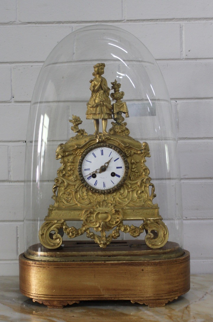 19th century French bronze maiden figured bracket clock under glass dome on stand.