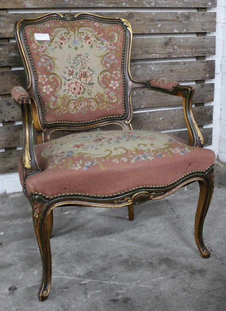 French Louis XVth lacquered and gilt decorated fauteuil having floral tapestry upholstery.