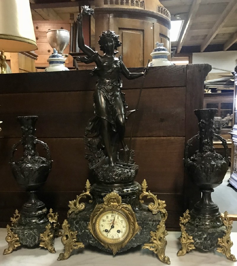 Three piece French 19th century maiden figured and green marble based clock set.