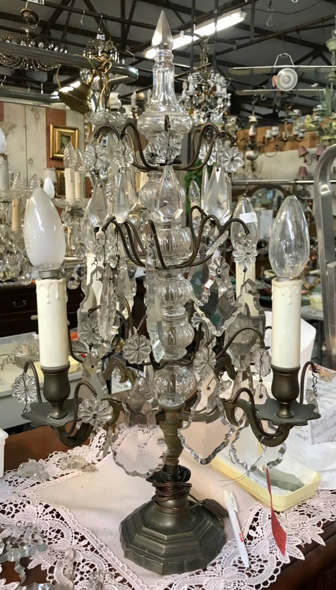 French early 20th century bronze 4 branch girindole table lamp with crystal crystal drops and prisms. 