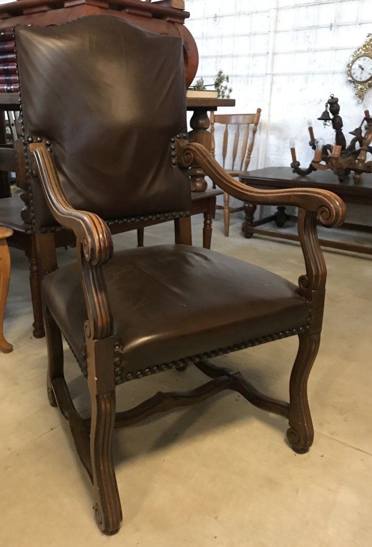 French early 20th century oak & brown upholstered fauteuil.