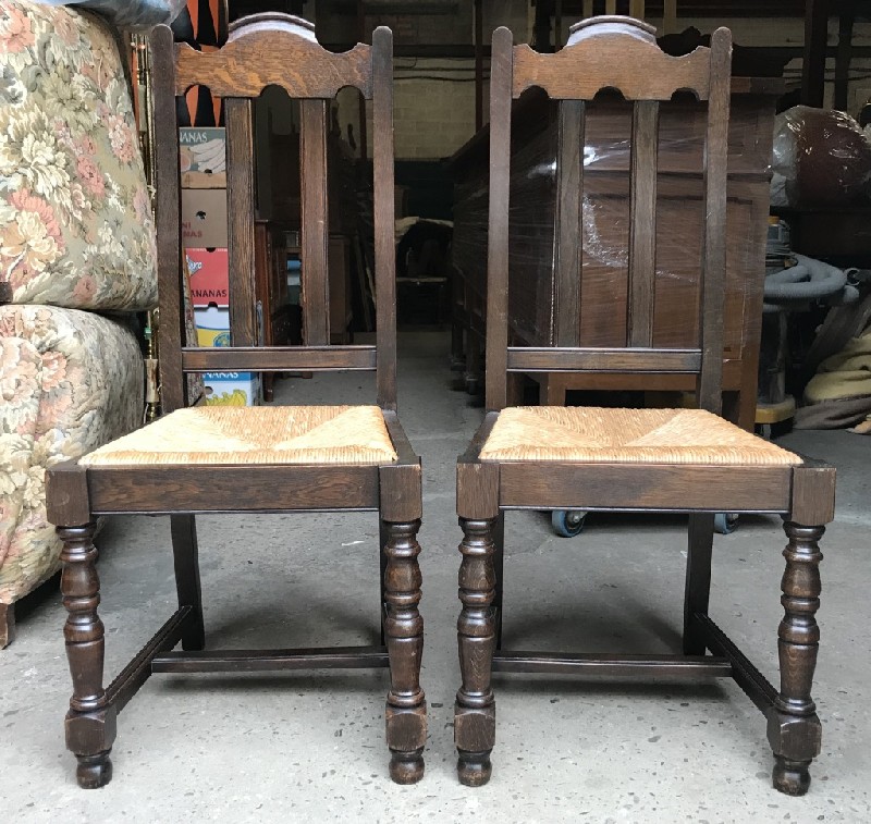 Set of six French oak & rush seated dining chairs.