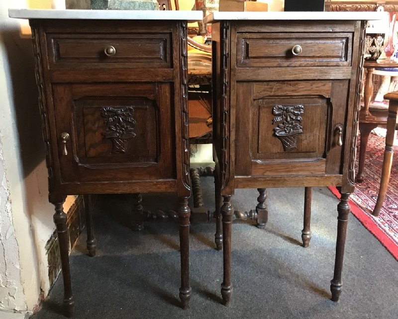 Pair of French floral oak & white marble top bedside cabinets.