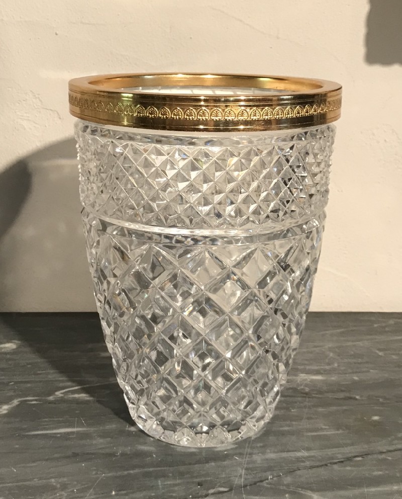 Cut crystal vase with brass rim and base.