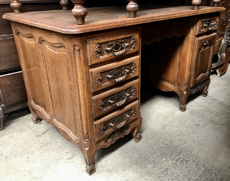French provincial oak twin pedestal bureau with parquetry top and bronze handles.