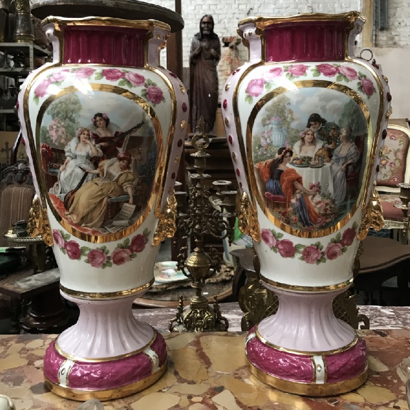 Fine pair of 19th century porcelain vases with courting scene panels having floral & gilt decoration. Original shop paper label on the base.