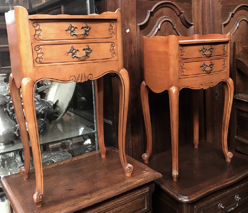 Pair of French provincial fruitwood two drawer bedside tables.