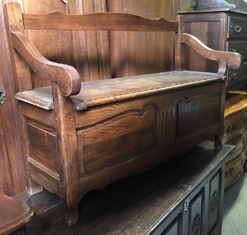 Late 19th century French country oak settle with lift up lid.