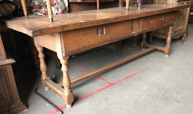 Interesting early 19th century French oak farm house kitchen table with two sliding bread doors, on stretcher base. 2.25 meters long.