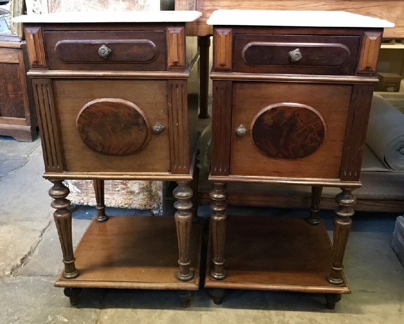 Pair of french 19th century mahogany bedside cabinets with white marble tops.