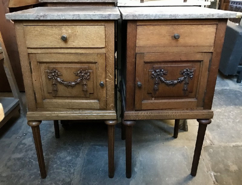 Pair of French floral oak & marble top bedside cabinets.