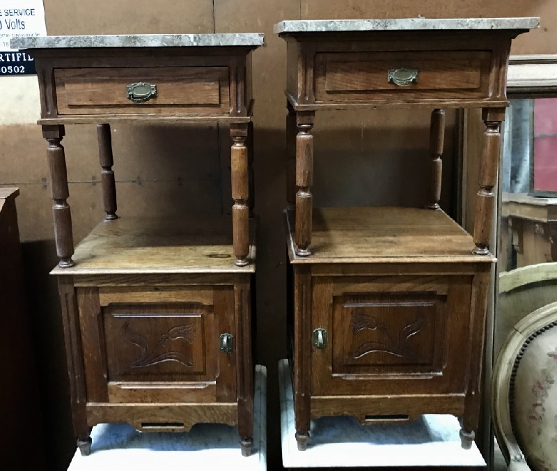 Pair of French oak & marble top bedside cabinets.