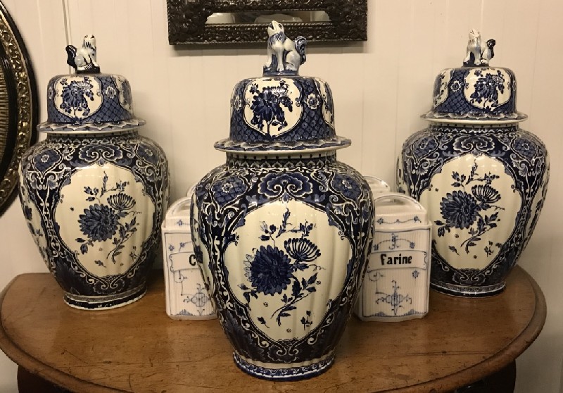 Set of 3 Delft porcelain & floral decorated covered vases.