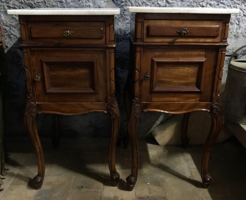 Pair of French Louis XVth walnut bedside cabinets with white marble tops.