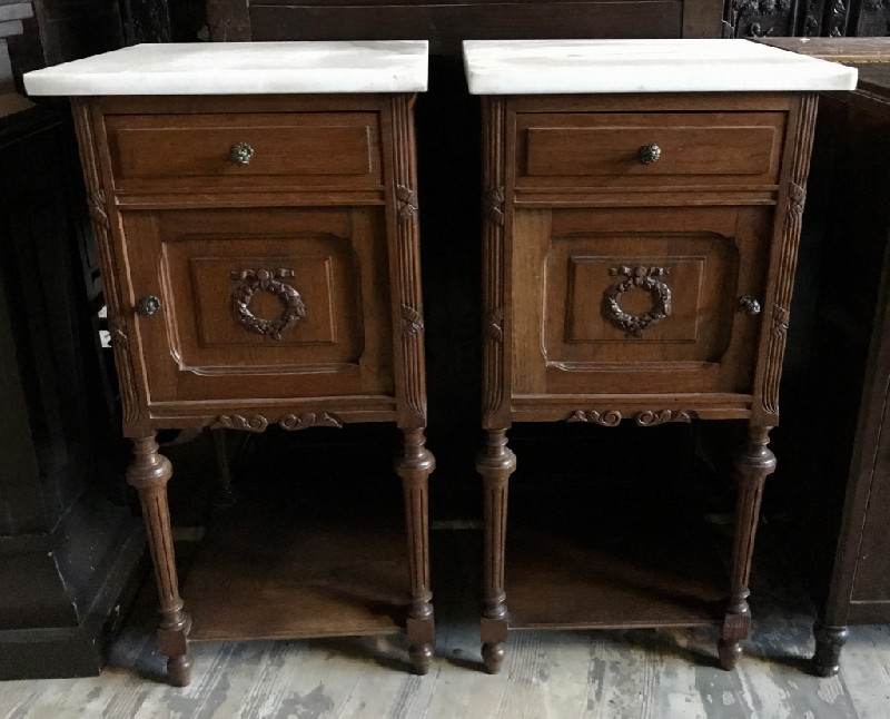 Pair of French walnut & carved bedside cabinets with white marble tops.