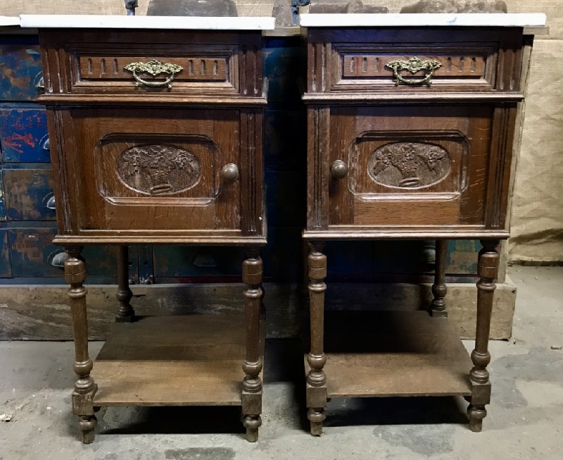 Pair of French carved oak & white marble top bedside cabinets.