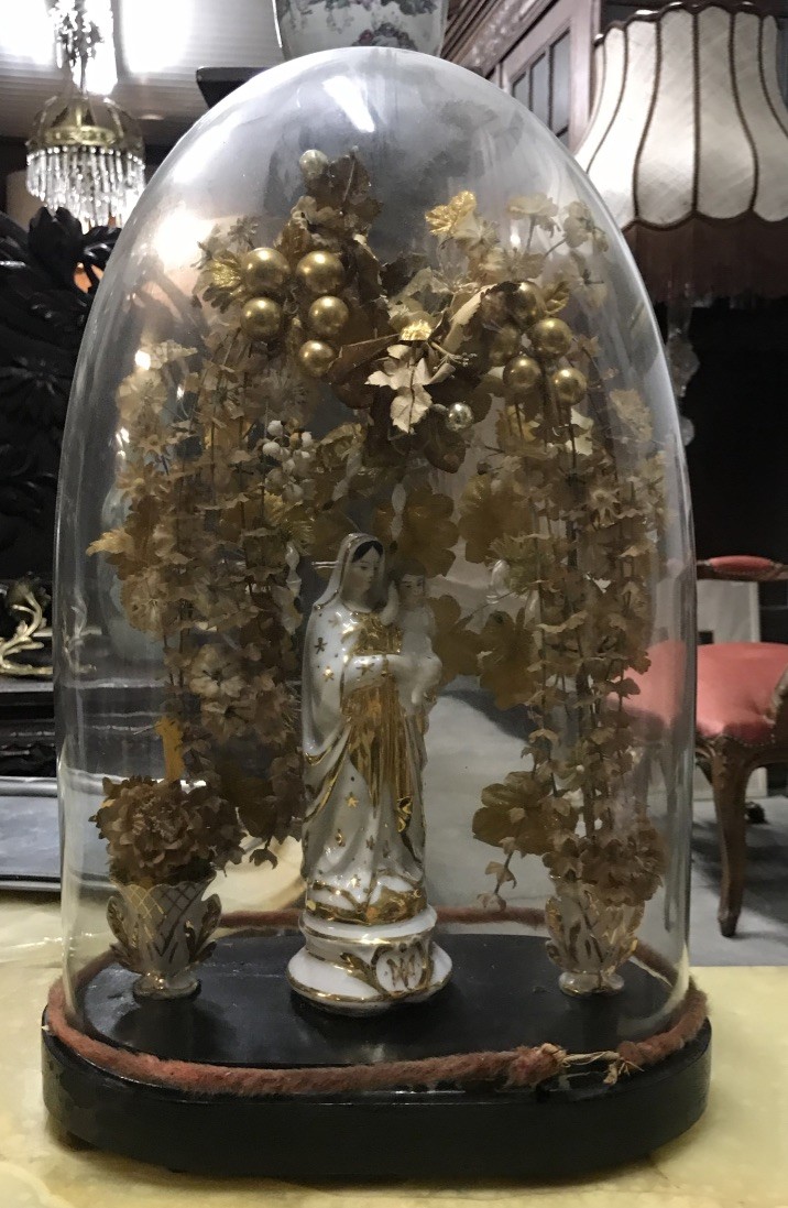 Antique French glass dome on stand with figures and flowers.