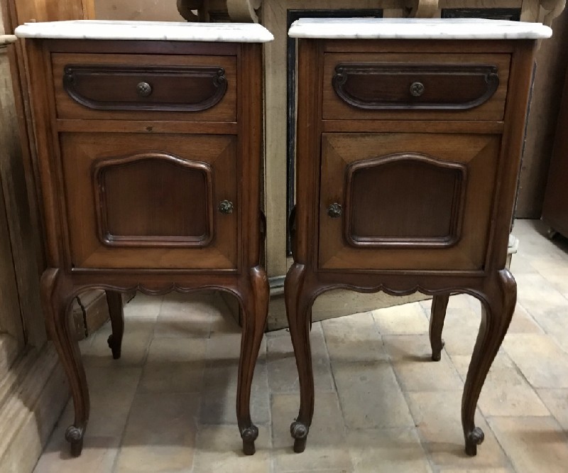 Pair of French 19th century walnut bedside cabinets with white marble tops.