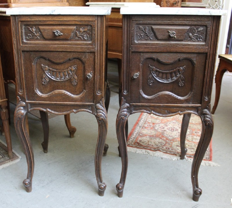 Pair of French Louis Xvth oak and white marble top bedside cabinets.