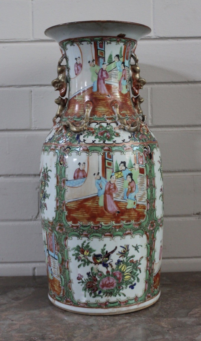 Japanese Imari pottery vase decorated with figures and landscapes.