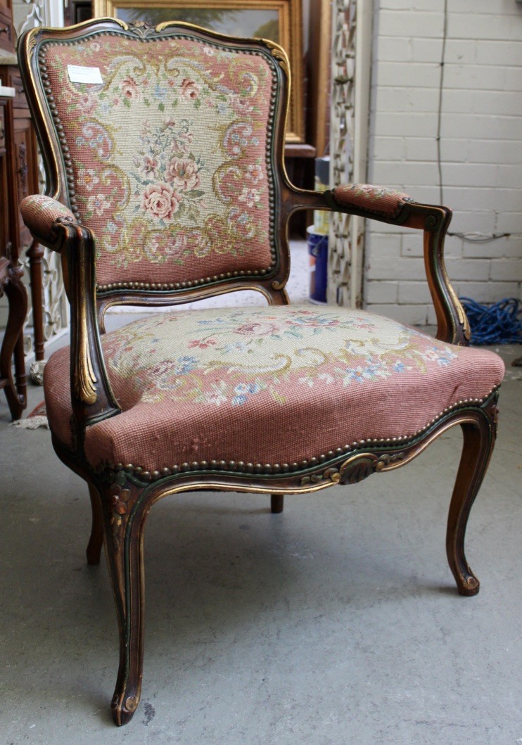 French Louis XVth walnut & gilt decorated fauteuil with tapestry upholstery.