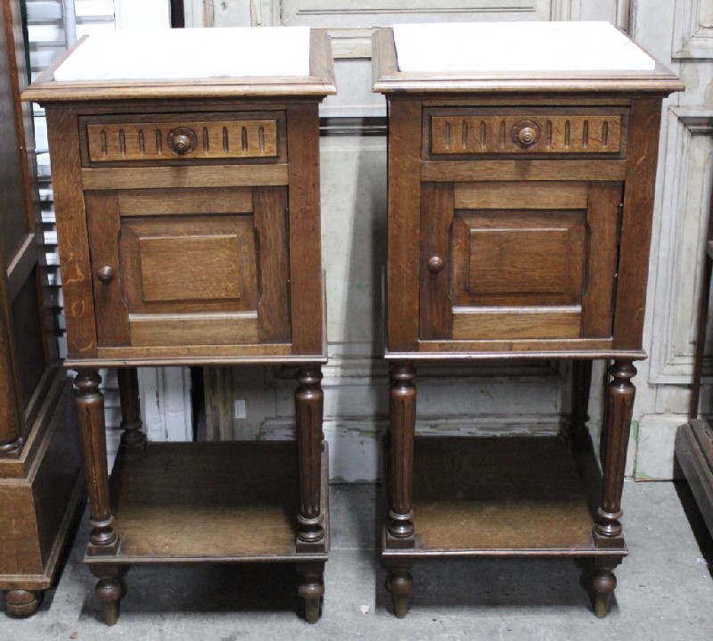 Pair of French oak & white marble top bedside cabinets.
