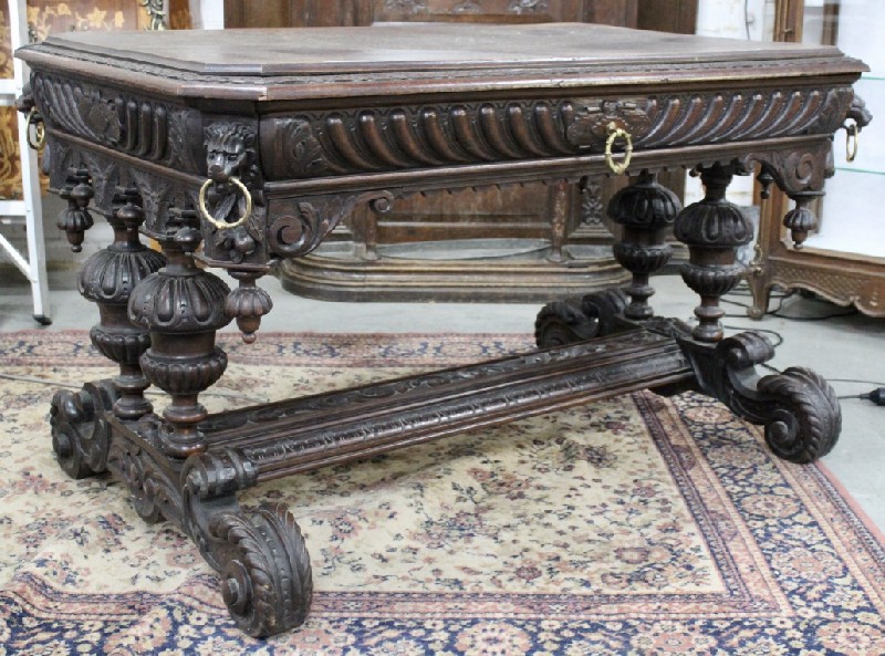 Impressive French 19th century carved oak one drawer bureau with stretcher base and bronze handles and rings.