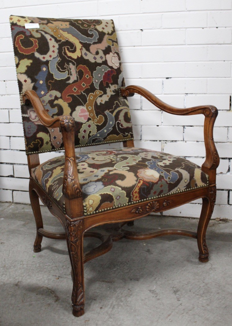 French Louis XVth walnut and tapestry upholstered fauteuil.