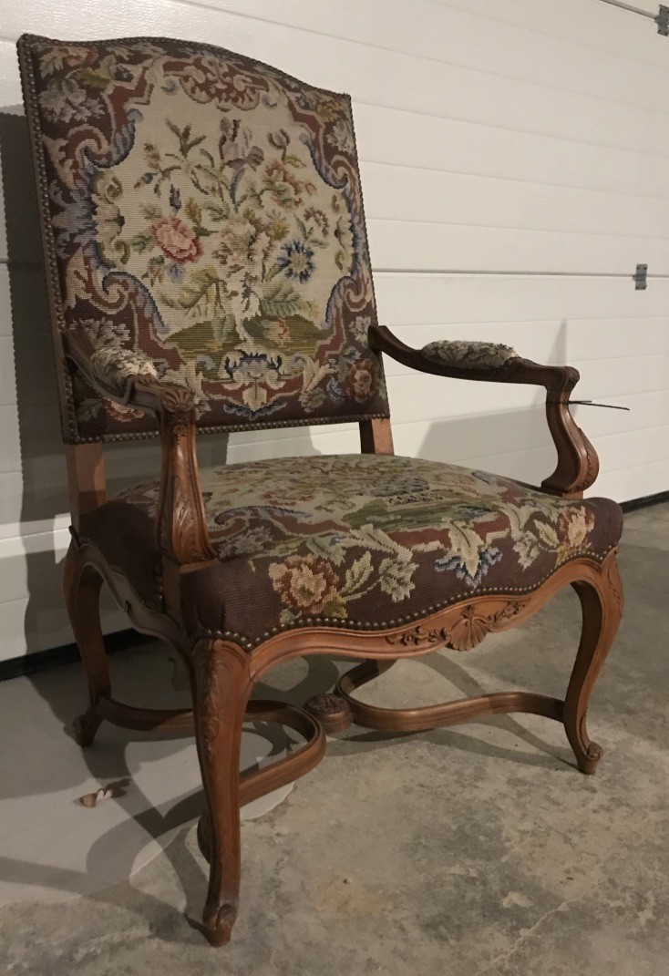 French Louis XVth walnut & floral tapestry upholstered fauteuil.
