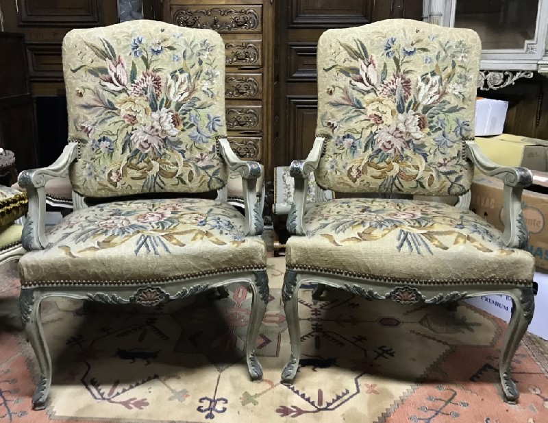 Pair of decorative French Louis XVTh lacquered fauteuils with floral tapestry upholstery.