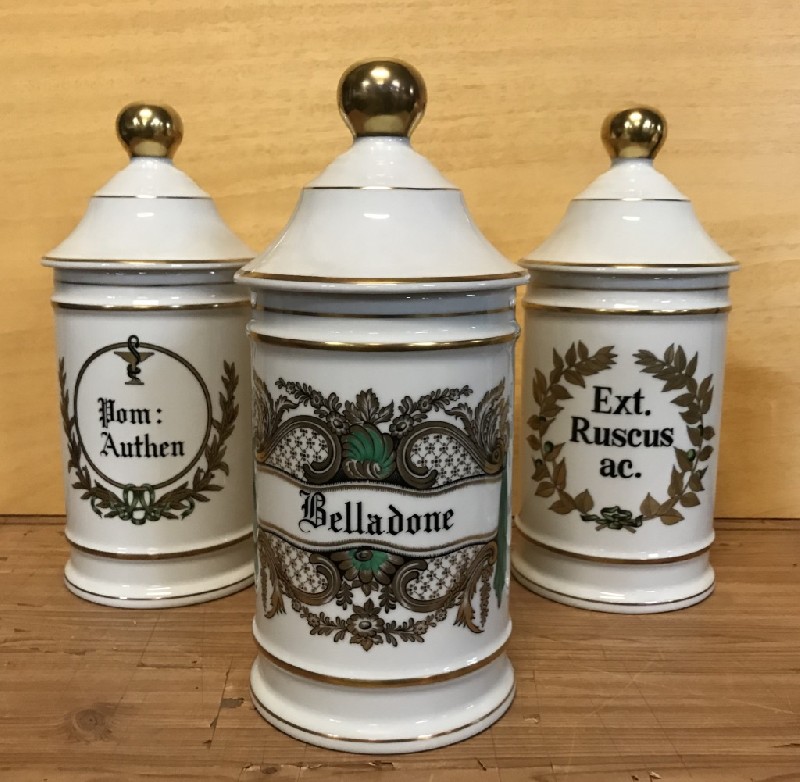 Set of six Limoges porcelain covered pharmacist jars.