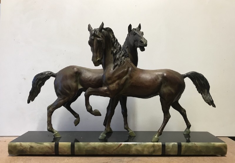 French spelter statue of two horses on marble and onyx base.