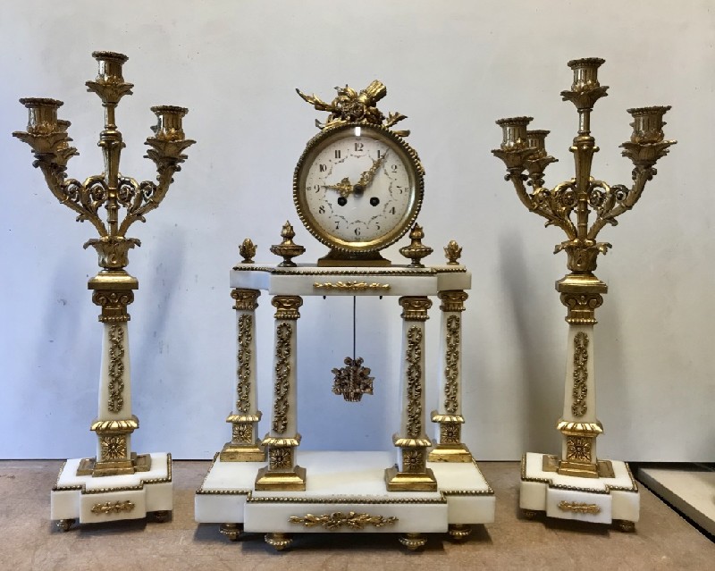 Superb 19th century french white marble and ormolu mounted clock set with sunburst pendulum.