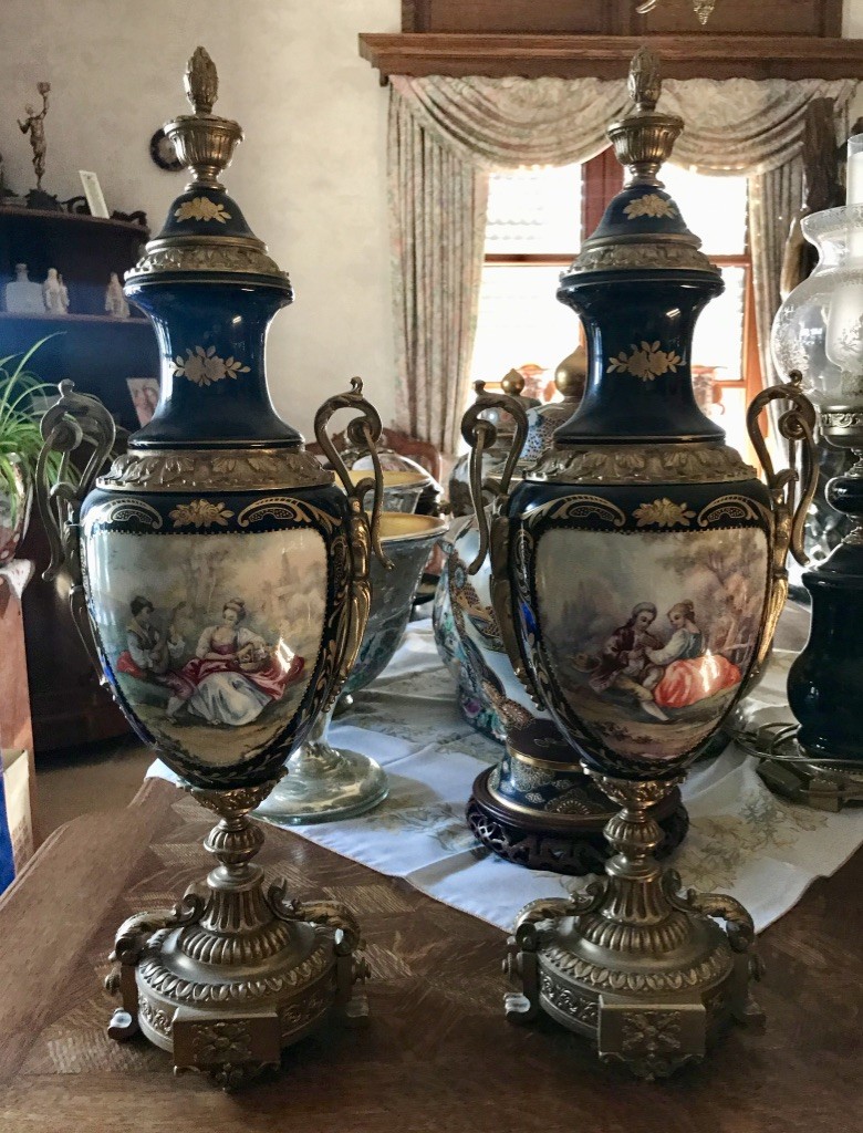 Fine quality set of three mid-20th century French Sevres style blue porcelain vase garniture, having bronze mounts and base with signed courting scene panels. 