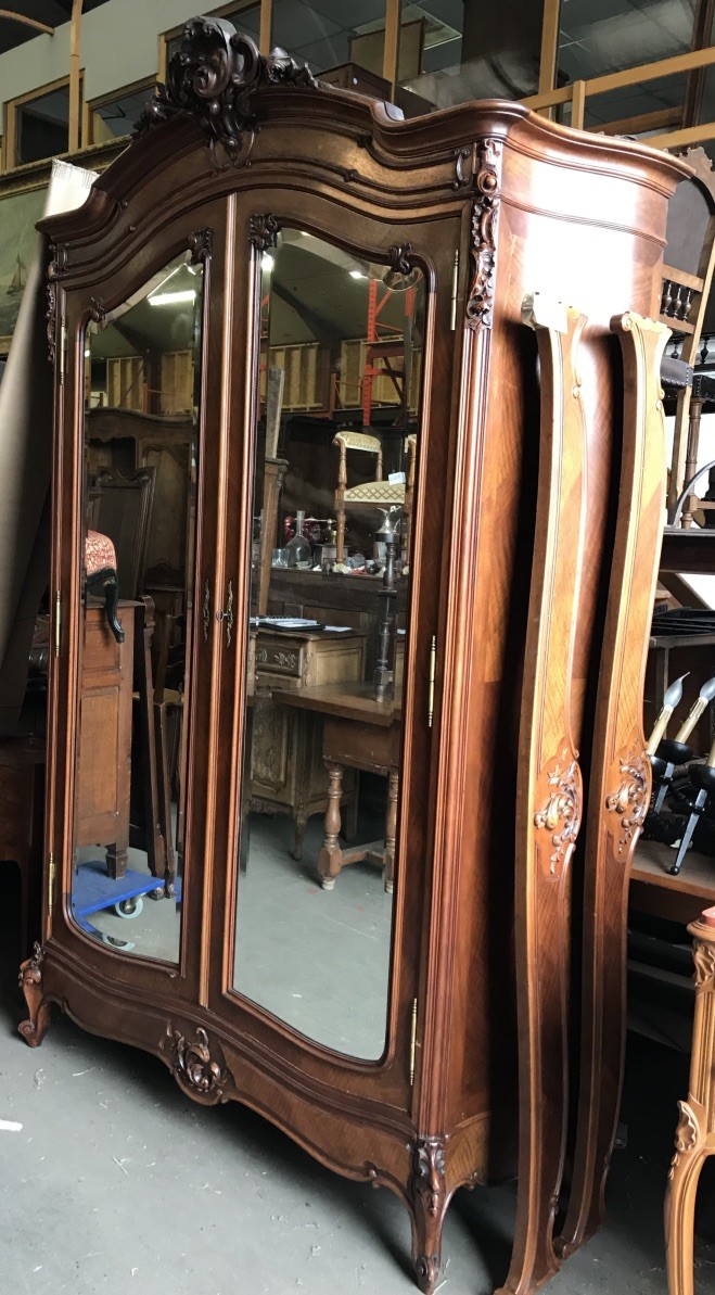 19th century French Louis XVth walnut 2 door armoire with serpentine shaped sides.