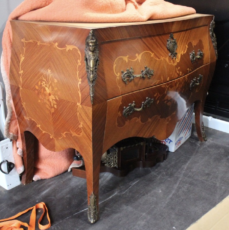 French Louis XVth walnut & floral marquetry inliad commode, having rouge marble top and brone mounts. Price $1850