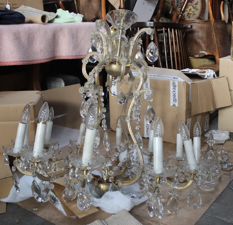 Large Maree Therese cut crystal 12 branch chandelier, having a harp shaped frame. Price $1750