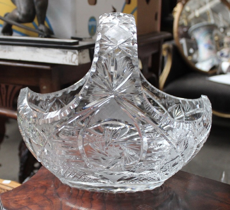 Heavy cut crystal bowl in the shape of a basket. Price $250