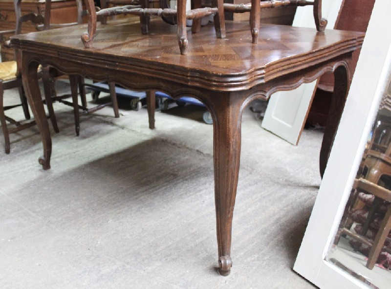 French provincial oak & parquetry top draw-leaf dining table. Price $1250