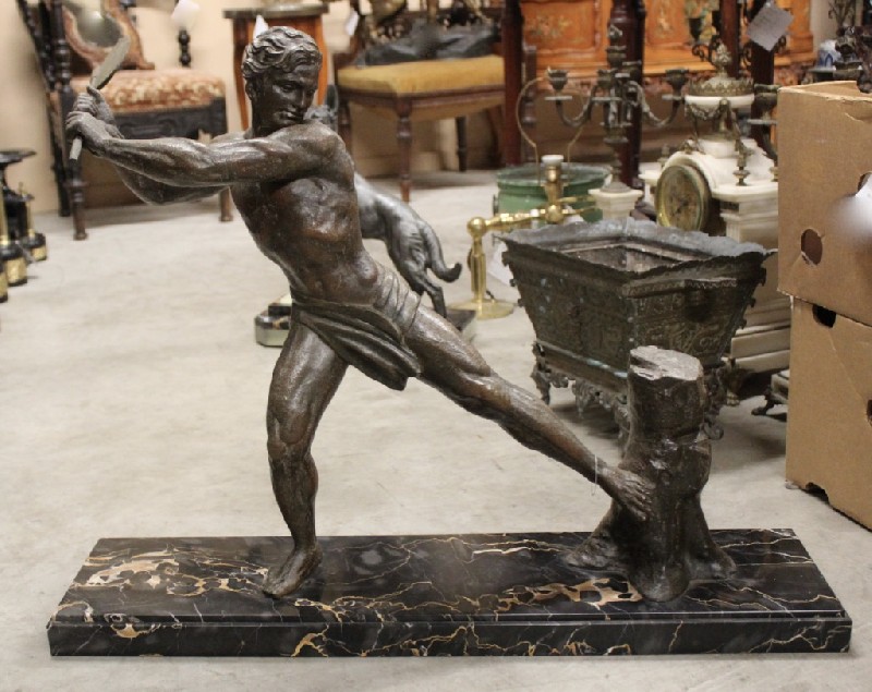 French art deco spelter statue of a male figure chipping wood, on black marble base. Price $1200