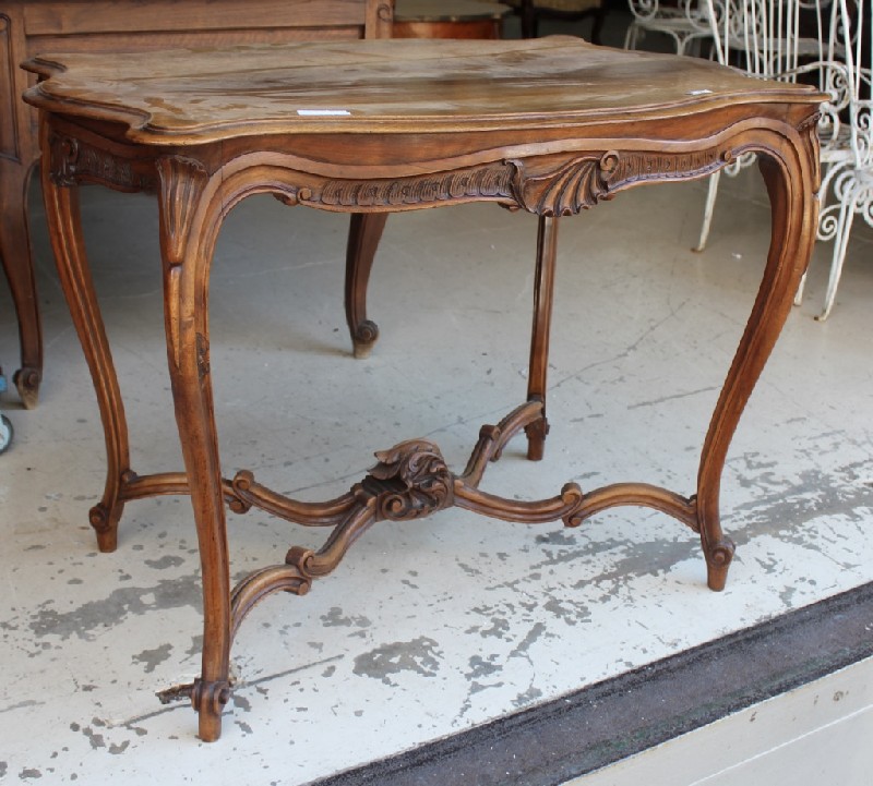 French late 19th century Louis XVth walnut and stretcher based salon table. Price $750