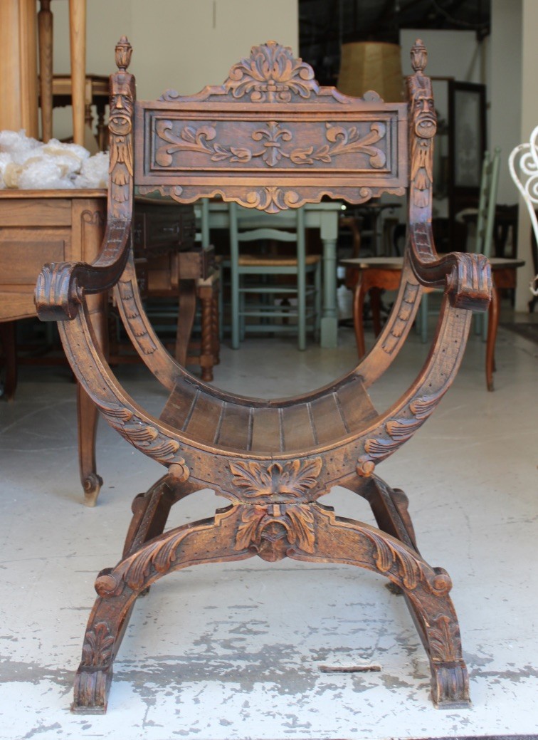 French late 19th century carved walnut X-stretcher arm chair. Price $495