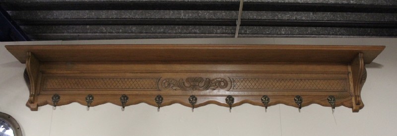 Large French carved oak coat rack with bronze hooks. Price $450