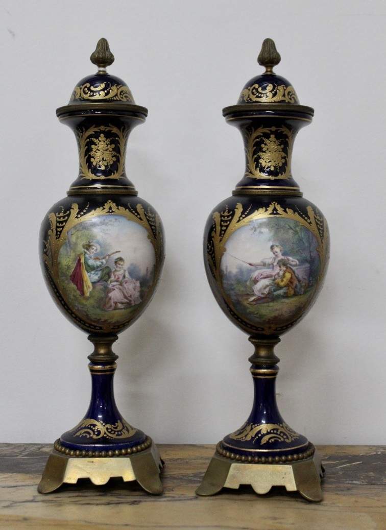 Super pair of 19th century French sevres porcealin and gilt decorated covered mantle vases, having courting scene & floral panels. Price $1500 pair