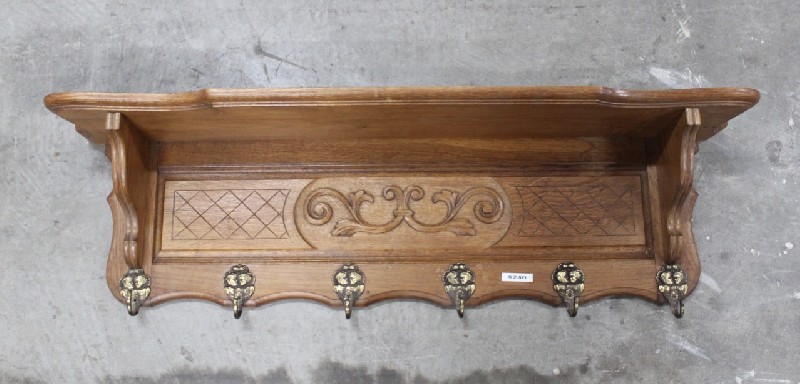 French carved oak coat rack with bronze hooks. Price $240